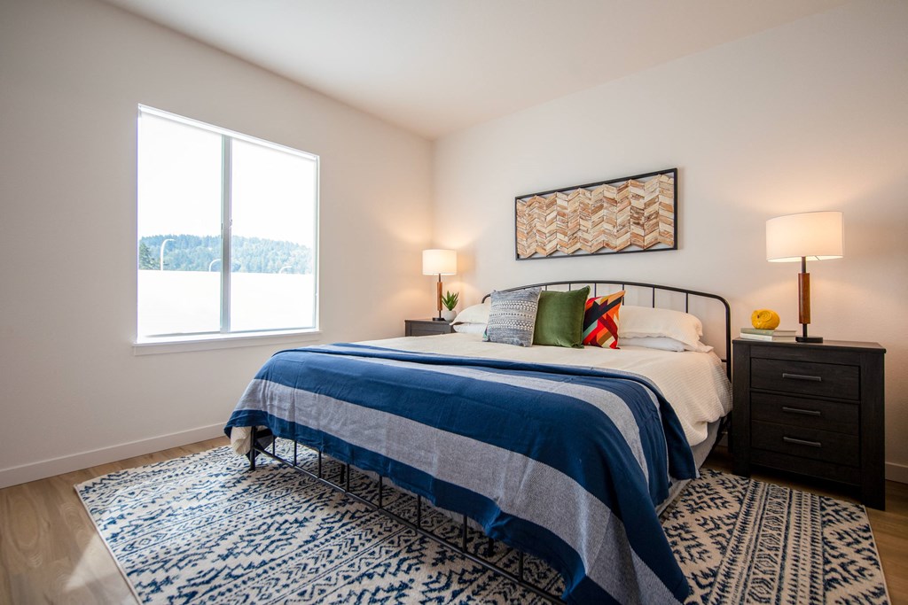 a bedroom with a bed and a windowat Scouter's Mountain, Happy Valley, OR