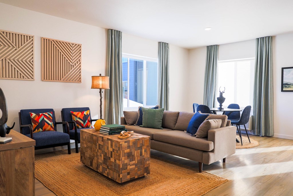 a living room with a couch and chairs and a tableat Scouter's Mountain, Happy Valley Oregon