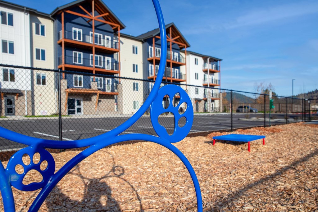a playground at a apartment complex with a blue swing setat Scouter's Mountain, Oregon