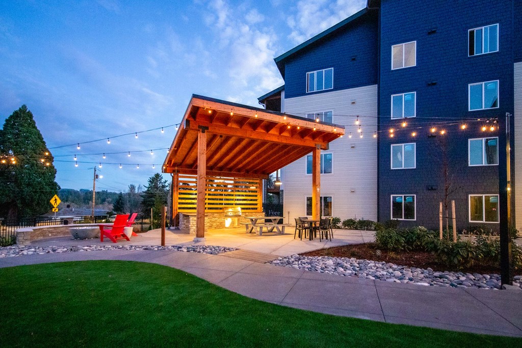 a patio with a wooden pavilion at nightat Scouter's Mountain, Happy Valley, OR 97086