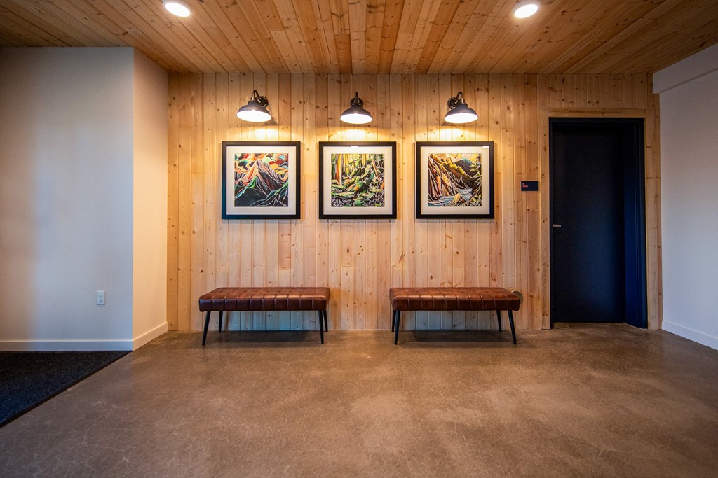a room with two benches and three paintings on the wallat Scouter's Mountain, Oregon