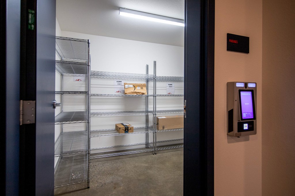 a door to a storage room with shelves and a monitor on the doorat Scouter's Mountain, Oregon, 97086