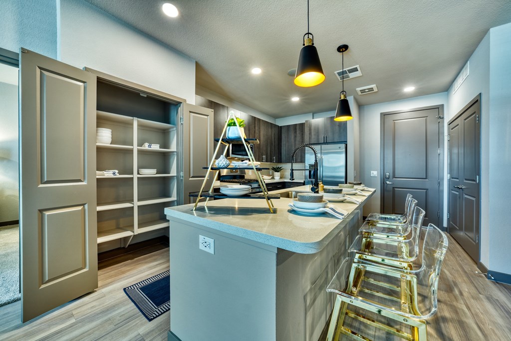 kitchen with island and pantry shelves at The Rey Downtown, Arizona