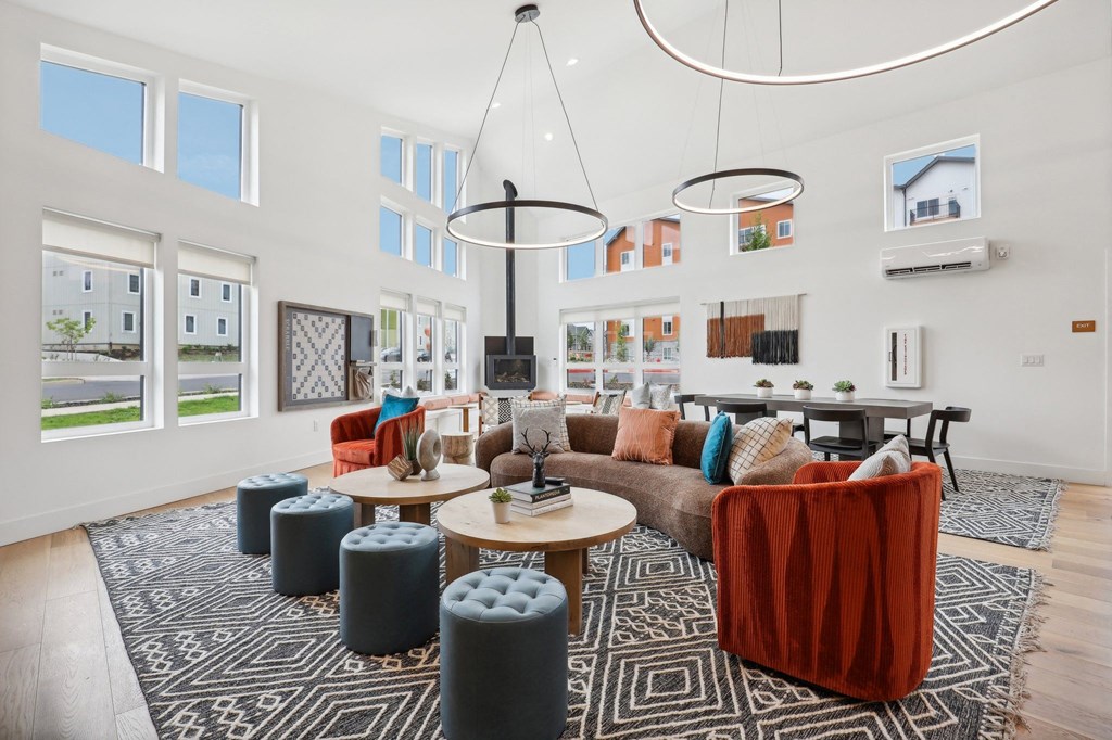 a living room with couches and chairs and a table at The Mill on Maple Apartments, Oregon City, OR 97045