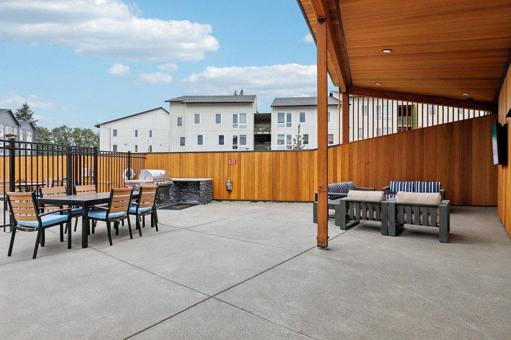 a restaurant with tables and chairs and a rainbow colored ceiling at The Mill on Maple Apartments, Oregon City, Oregon