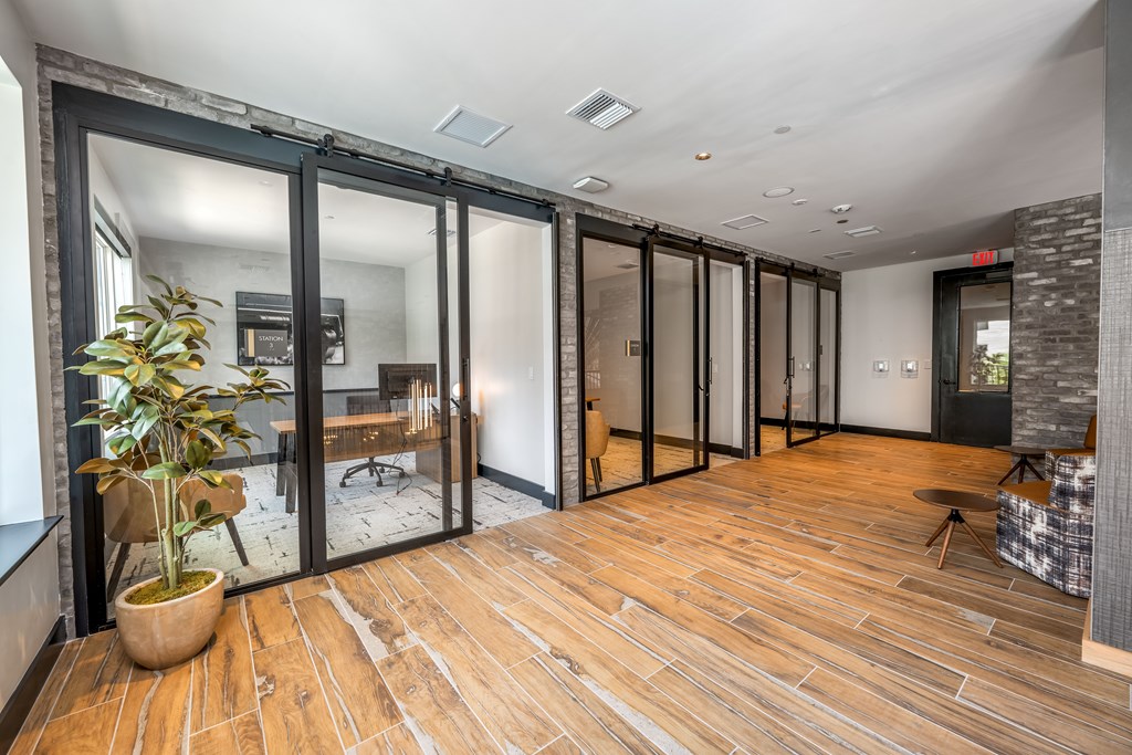 A room with a wooden floor and glass doors.