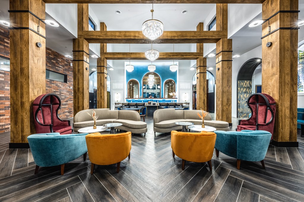 the lobby of a restaurant with tables and chairs and a bar at The Alibi at Lake Lilly, Ocoee, FL