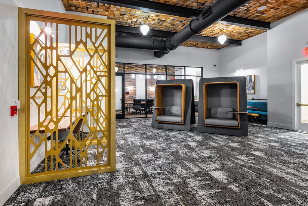 a room with three chairs and a large yellow screen