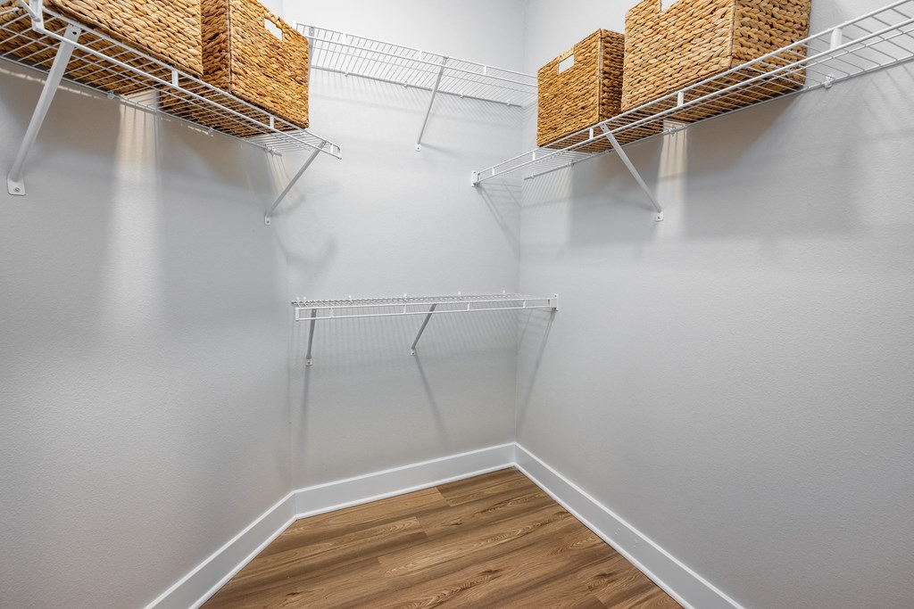 our spacious walk in closets are equipped with shelves and wire baskets at The Alibi at Lake Lilly, Ocoee, FL
