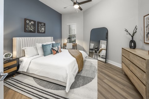 A Bedroom with a Large Bed at The Haven at Lake Britt Apartments, Winter Garden, Florida