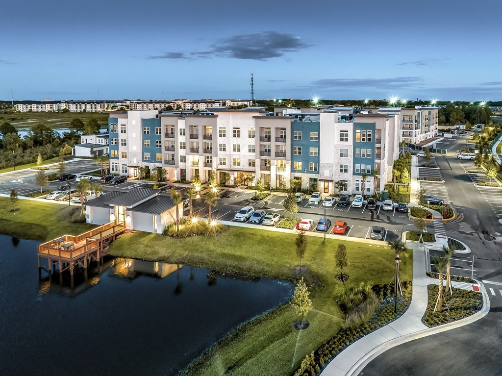 an aerial view of an apartment building overlooking a body of waterat The Overlook, Winter Garden