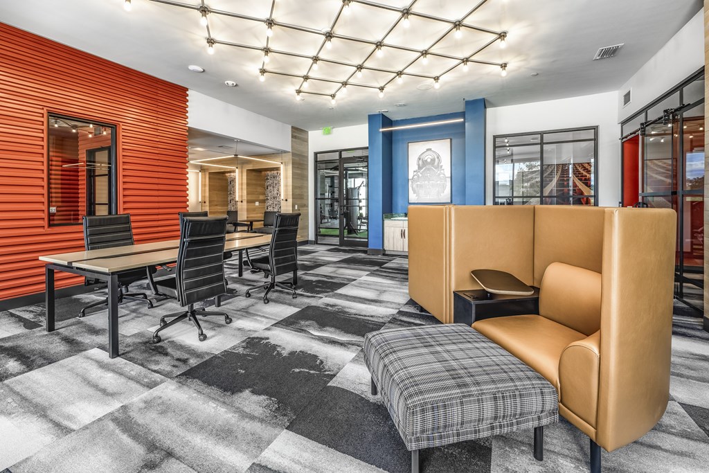 a conference room with chairs and tables and a couch at The Overlook, Winter Garden