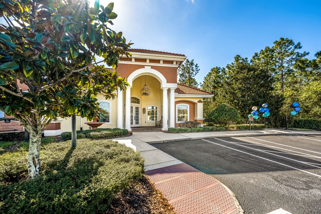 a building with a parking lot in front of it