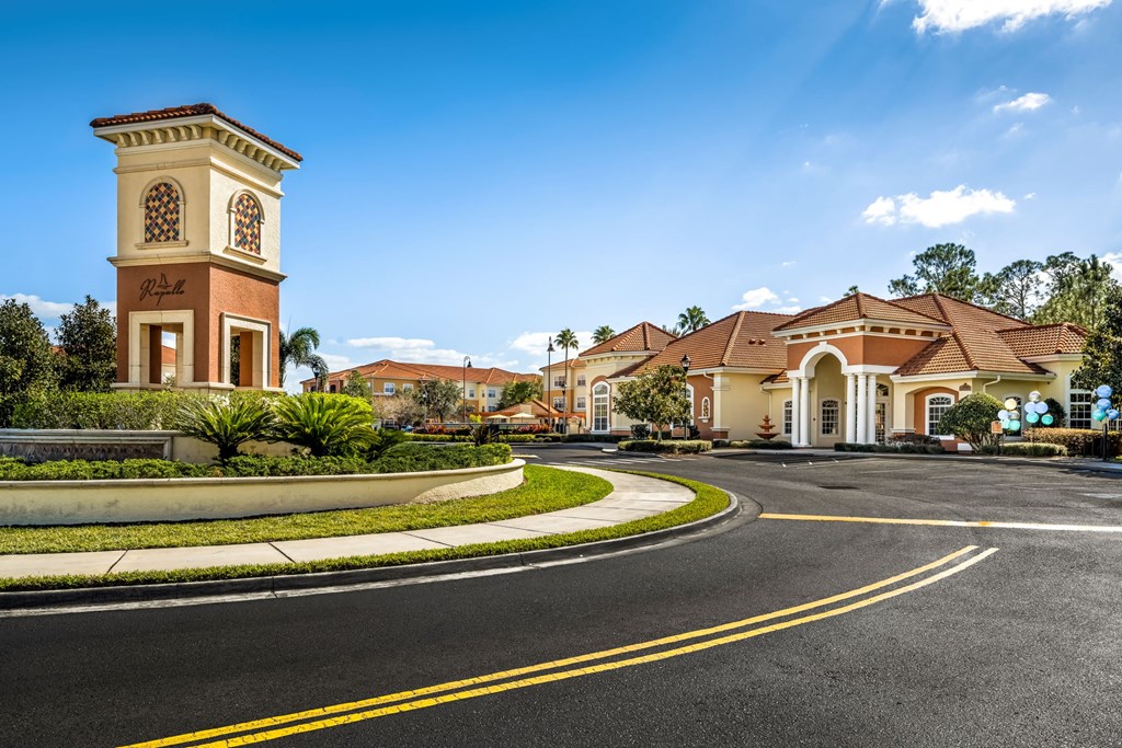 a roundabout in front of a building with a clock tower