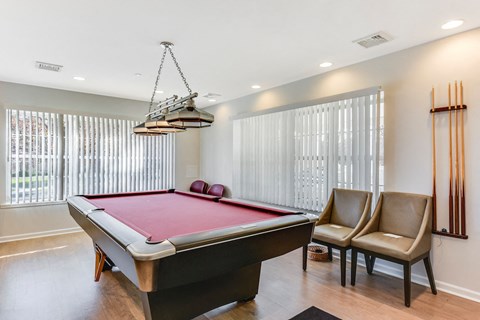 Billiards room with pool table and seating area at Eagle View Court 55+ Community Apartments, Middle Island, 11953