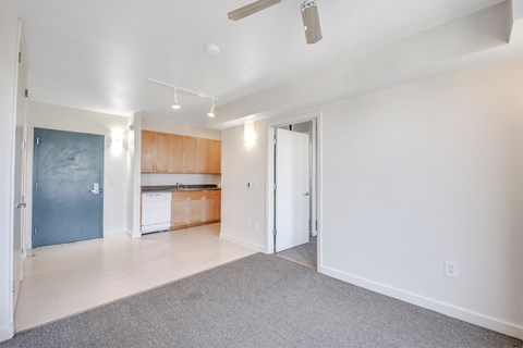 A spacious living room with a kitchen in the background. at Acton Courtyard, Berkeley, 94703