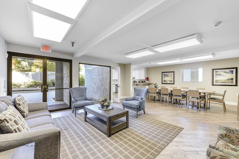 A living room with a grey couch and a coffee table.