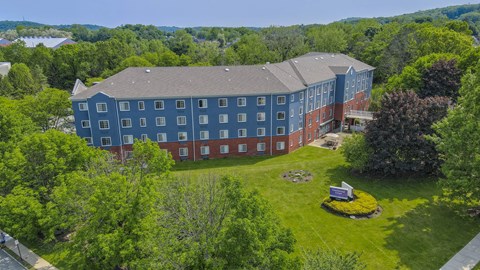 Aerial view of colorful apartment community with landscaping at Centennial Court Apartments, Wharton, NJ 7885