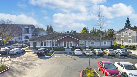 Property management office with front parking lot at Geneva Pointe Apartments, California
