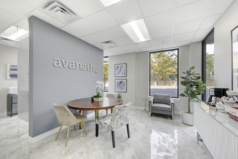 A vanath office space with a table and chairs.