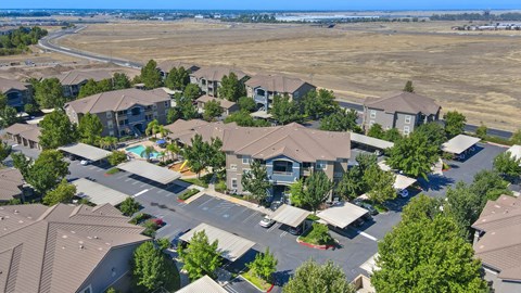 A bird's eye view of a residential area with houses and trees.