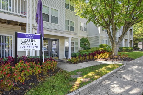 A leasing center sign in front of a building at Acclaim at Sterling, Sterling, VA, 20164