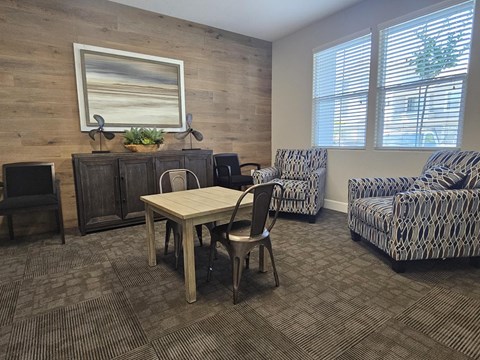 A room with a wooden wall and a painting on it.