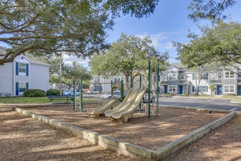 Playground with a slide at Wellington Woods Apartments, Florida, 34741