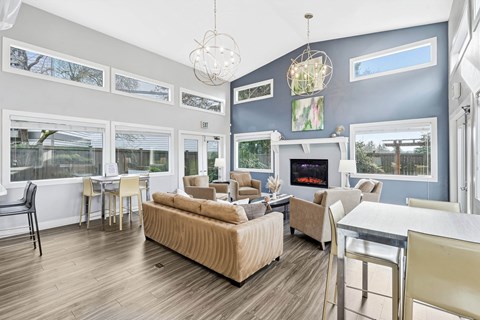 Clubhouse lounge with vaulted ceilings and accent wall at Latitude Apartments, Washington, 98204