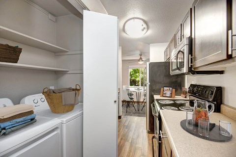 A kitchen with a white refrigerator and a white oven.