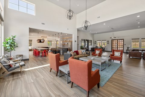 A modern living room with wooden floors and furniture.
