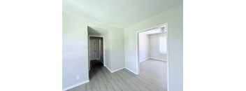 A room with a doorway leading to another room.