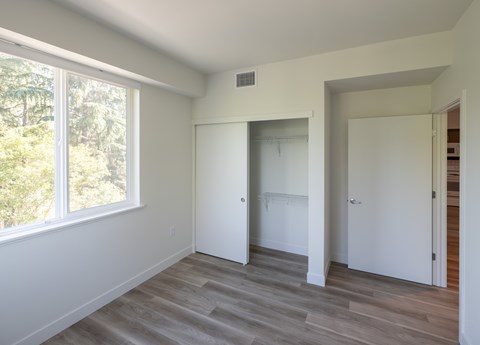 A room with a window and a door.