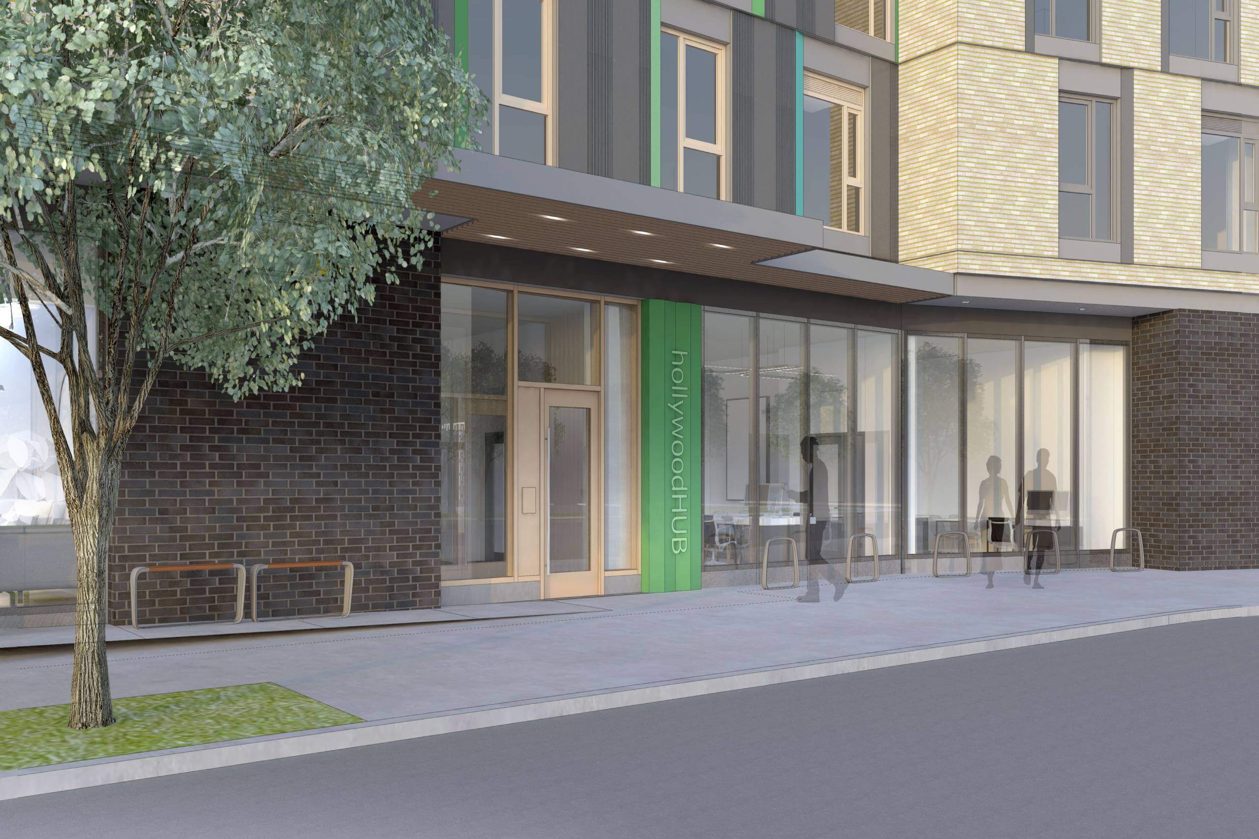 A modern building with a green sign on the door.