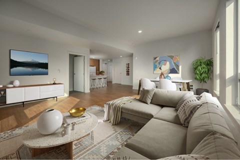 A living room with a grey sofa and a coffee table.
