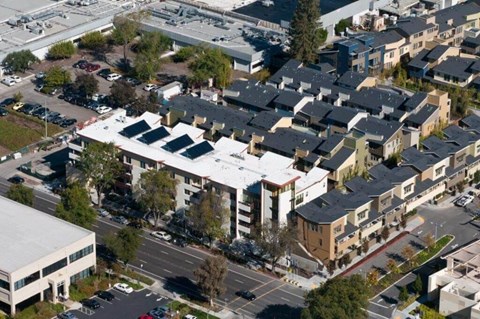 A large building with a parking lot in front of it.