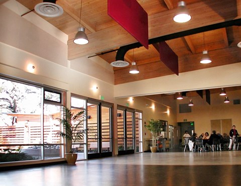 A large open space with people sitting at tables.