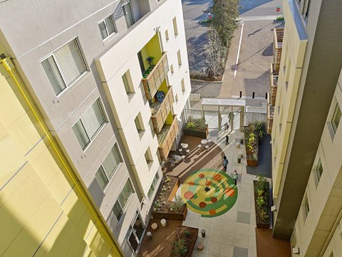 A courtyard with a circular design in the middle of it.