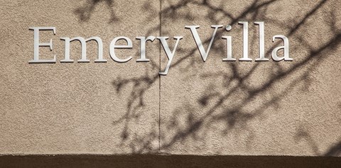 The word EmeryVilla is written on a wall.