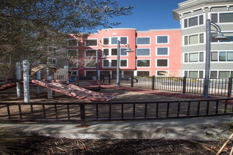 A building with a red fence in front of it.