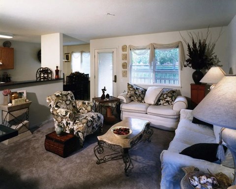 A living room with a couch, chair, and coffee table.