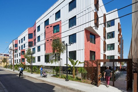 A modern building with red and white panels.