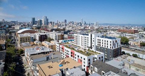 A cityscape with buildings of various sizes and colors.