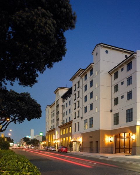 A long building with lights on the front.