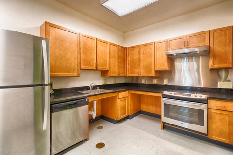 A kitchen with wooden cabinets and stainless steel appliances.