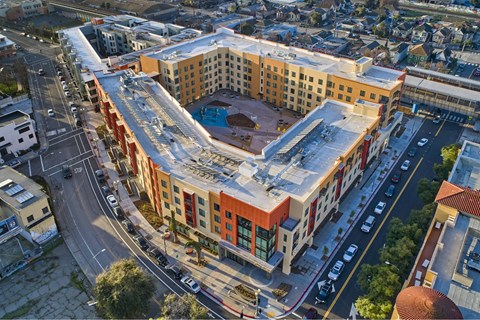 A large building with a pool in the middle of it.