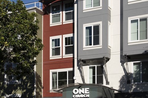 A building with a sign that says "ONE CHURCH".