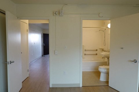 A bathroom with a toilet, sink, and bathtub.