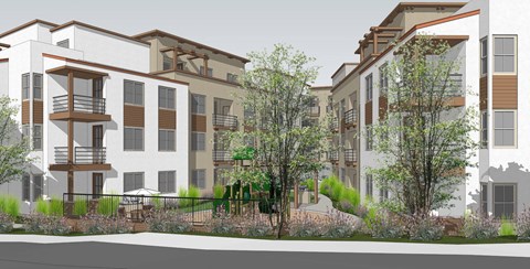 A modern apartment complex with balconies and trees in front.