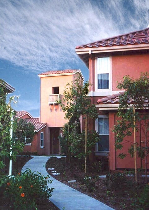 A red house with a white door and windows.